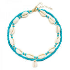Dubbele ketting met kaurischelp turquoise