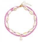 Dubbele ketting met kaurischelp roze