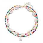Dubbele ketting met kaurischelp multikleur
