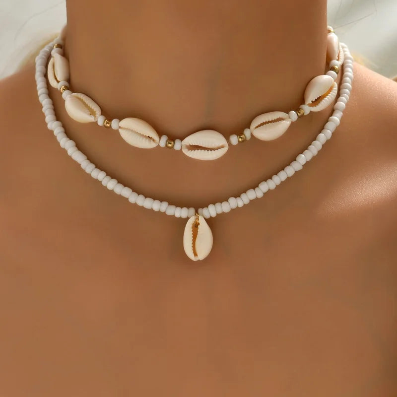 Dubbele ketting met kaurischelp wit