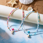 Dubbele schelpketting met gekleurde kralen in blauw ster
