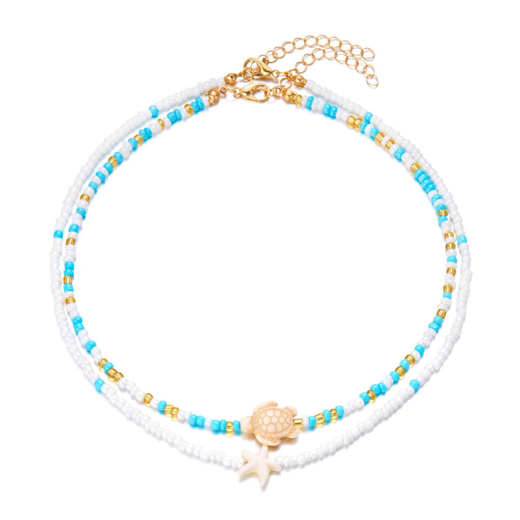 Dubbele schelpketting met gekleurde kralen in blauw schildpad