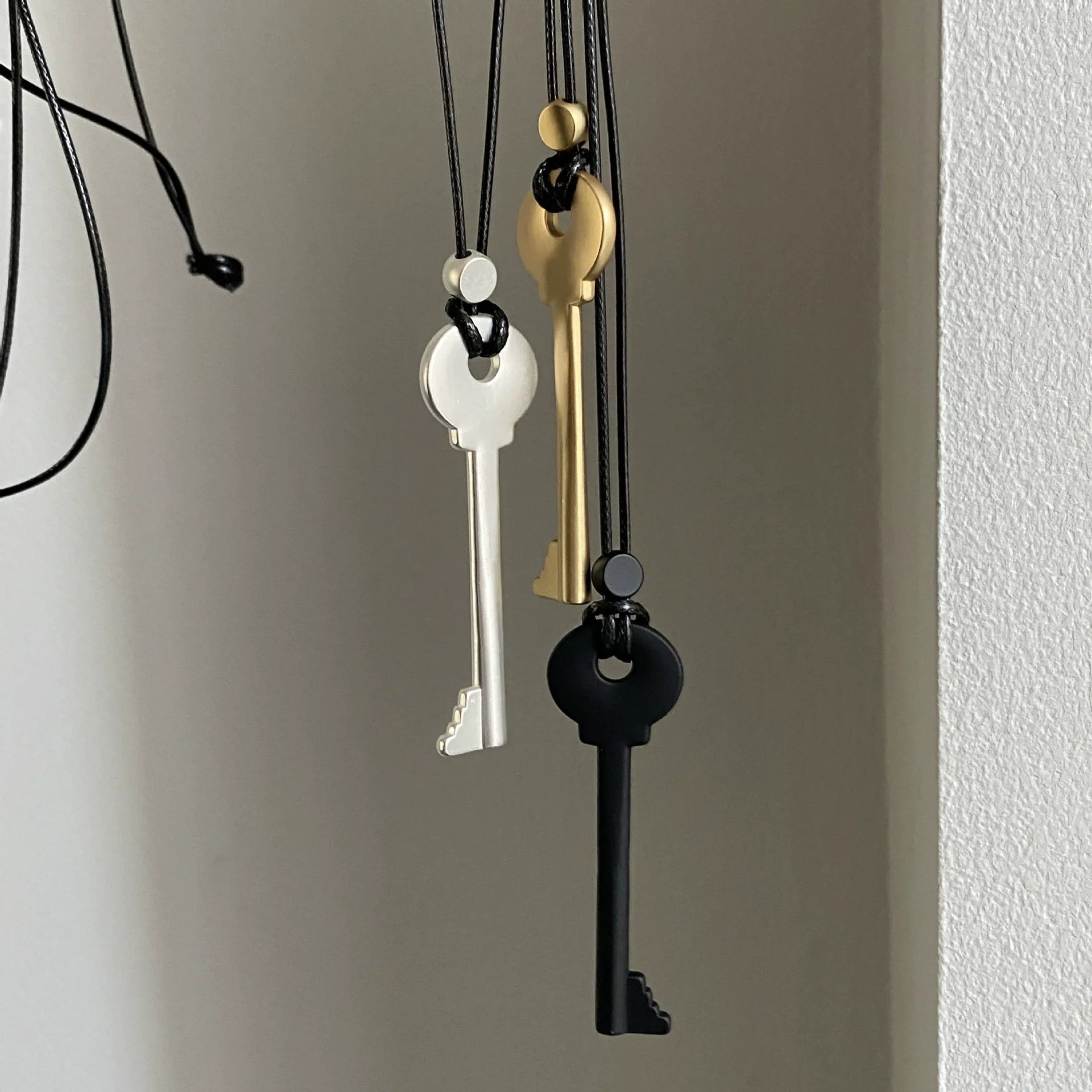 Lange koordketting met sleutelhanger in zwart