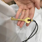 Lange koordketting met sleutelhanger in goud