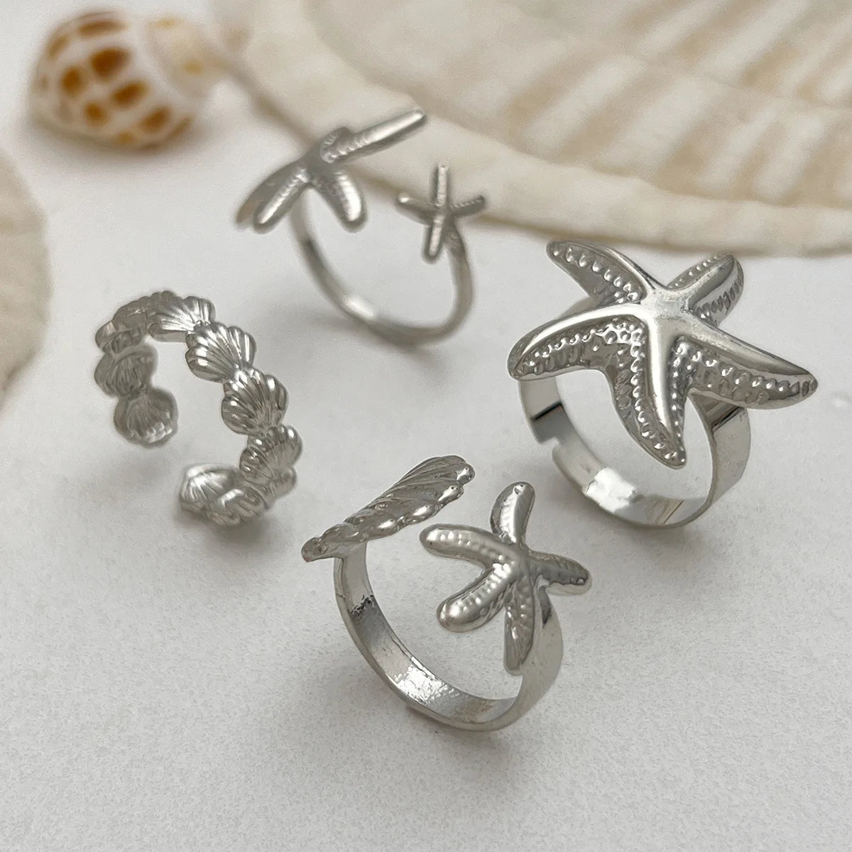 Set van 4 schelp- en zeester-ringen zilver