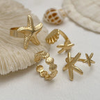 Set van 4 schelp- en zeester-ringen goud