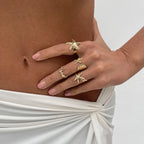 Set van 4 schelp- en zeester-ringen goud