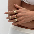Set van 4 schelp- en zeester-ringen goud